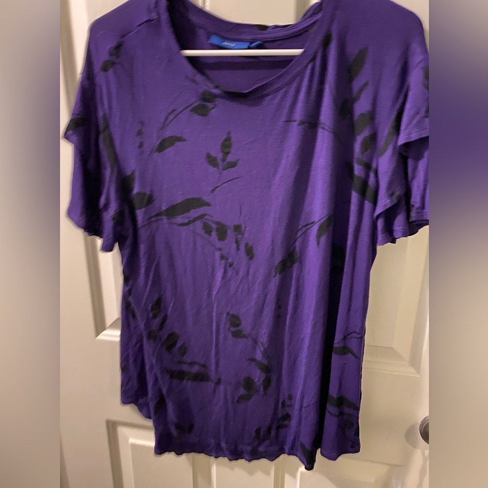 Purple blouse with black floral detail. Layered detail sleeve